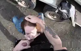 Busty redhead fucks on police car